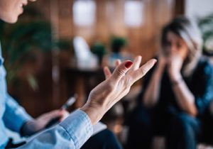 people talking with their hands in a cognitive-behavioral therapy program 