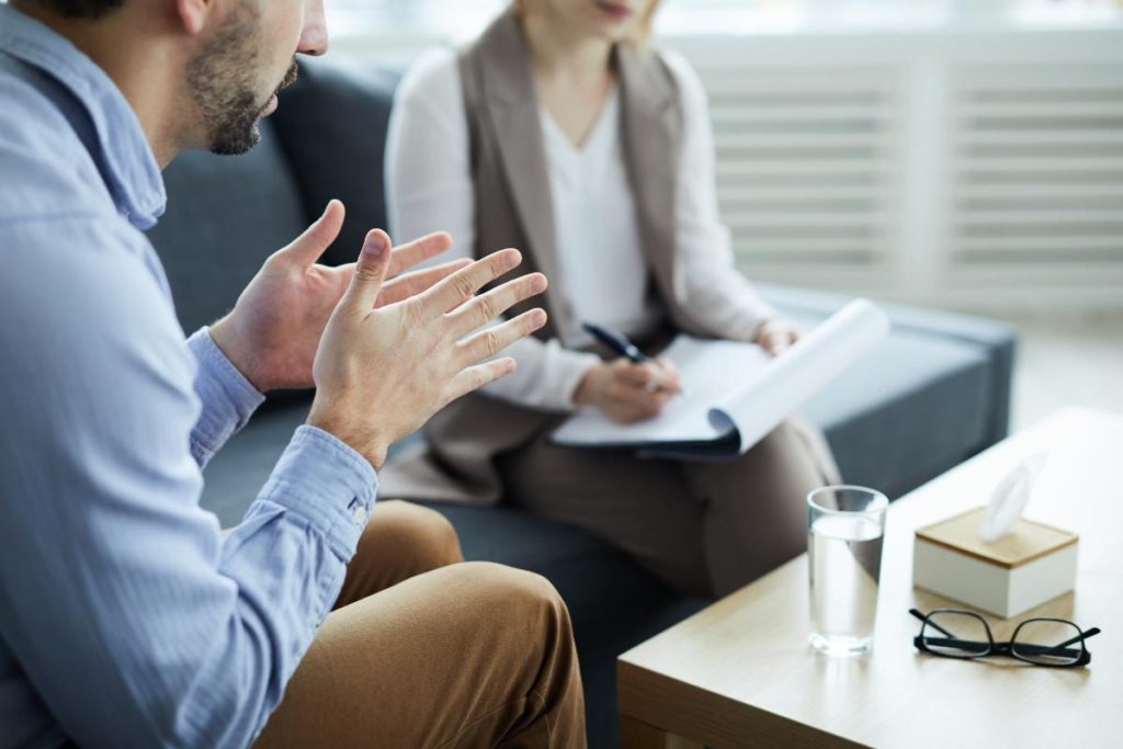 man talking with therapist about what is cognitive-behavioral therapy