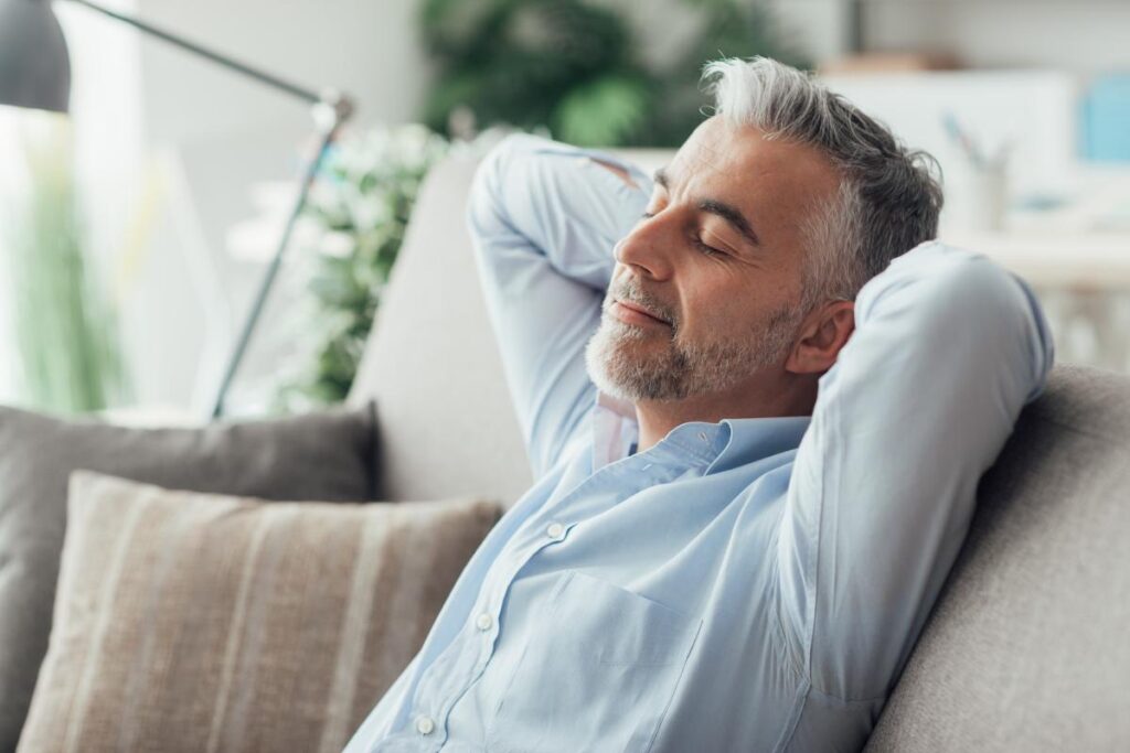 man leans back and considers ways to cope with anxiety