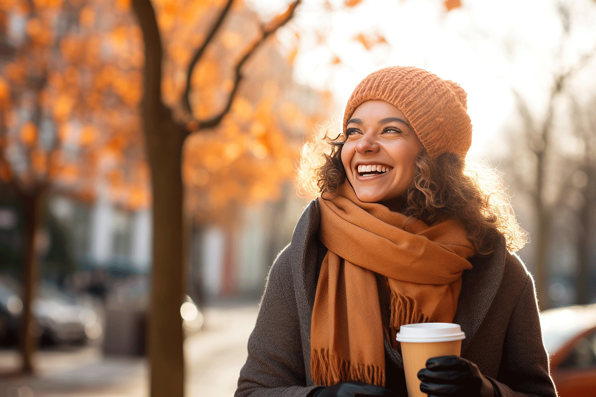 woman smiles in fall while considering how to overcome seasonal depression